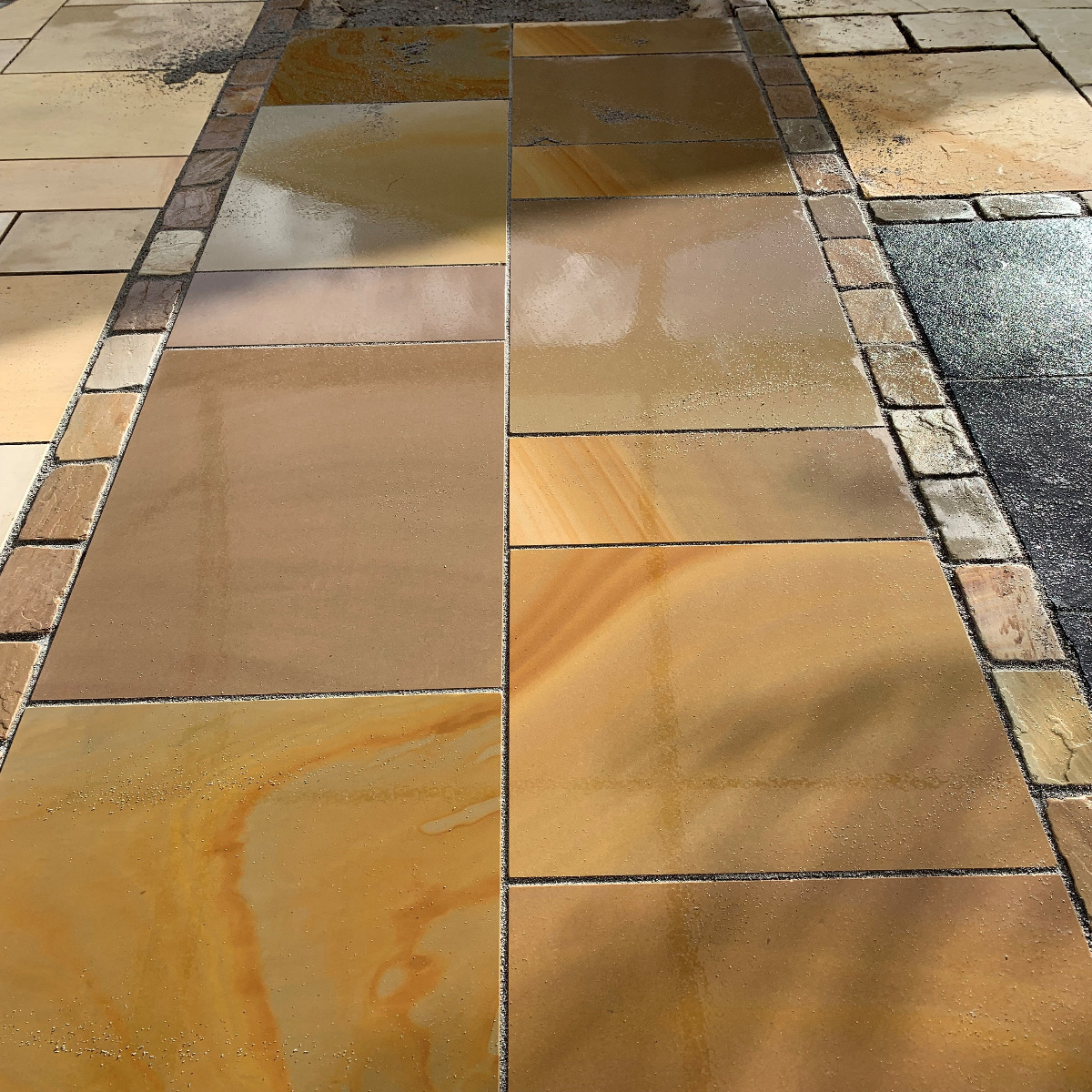 Indian Sandstone paving in warm orange and brown tones 